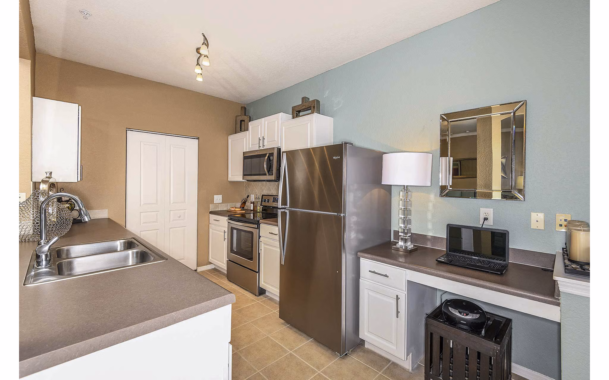 Modern kitchen featuring stainless steel appliances at Villas at Gateway Apartments