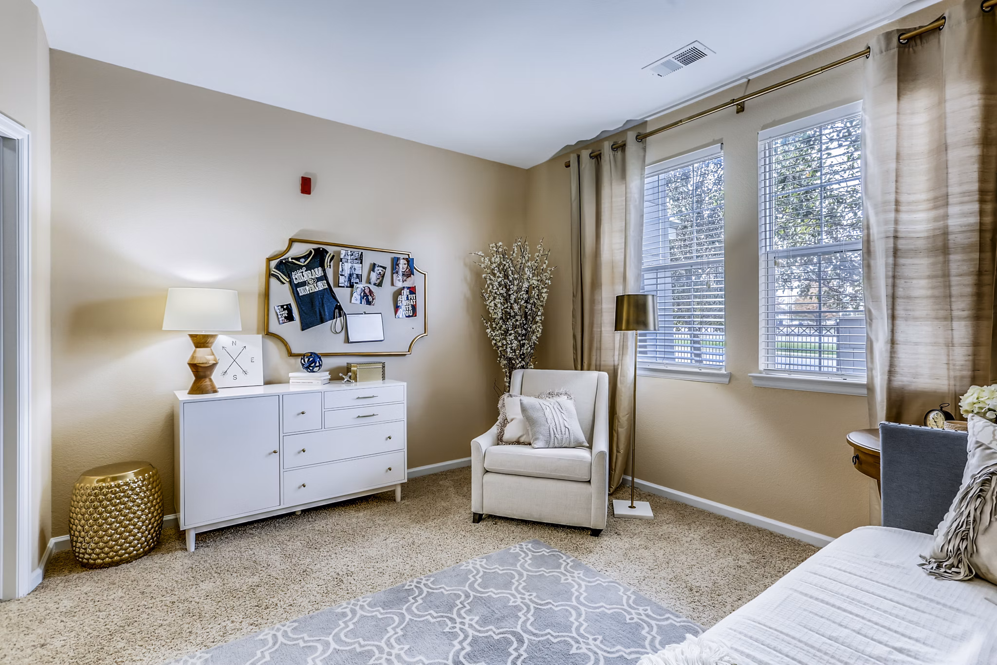 Elegant bedroom with contemporary design and large windows at Waterford Lone Tree Apartments