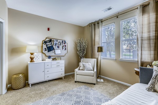 Elegant bedroom with contemporary design and large windows at Waterford Lone Tree Apartments