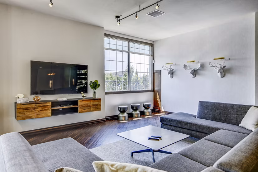 Lobby with modern decor and seating at Waterford Lone Tree Apartments clubhouse