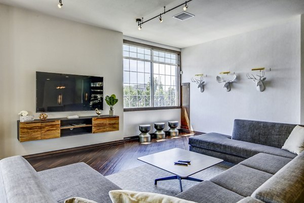 Lobby with modern decor and seating at Waterford Lone Tree Apartments clubhouse