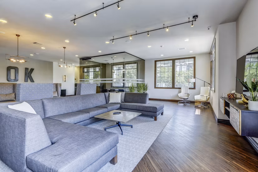 Clubhouse with modern design elements at Waterford Lone Tree Apartments, featuring luxurious seating and ambient lighting
