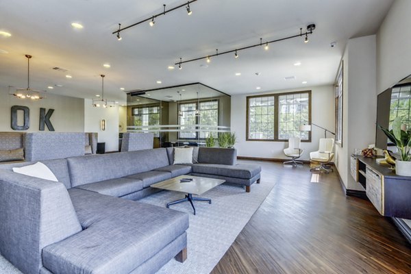 Clubhouse with modern design elements at Waterford Lone Tree Apartments, featuring luxurious seating and ambient lighting