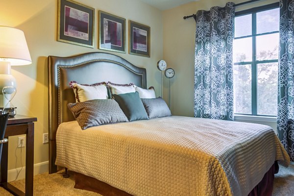 Bedroom featuring elegant decor and a king-sized bed at The Westheimer Apartments