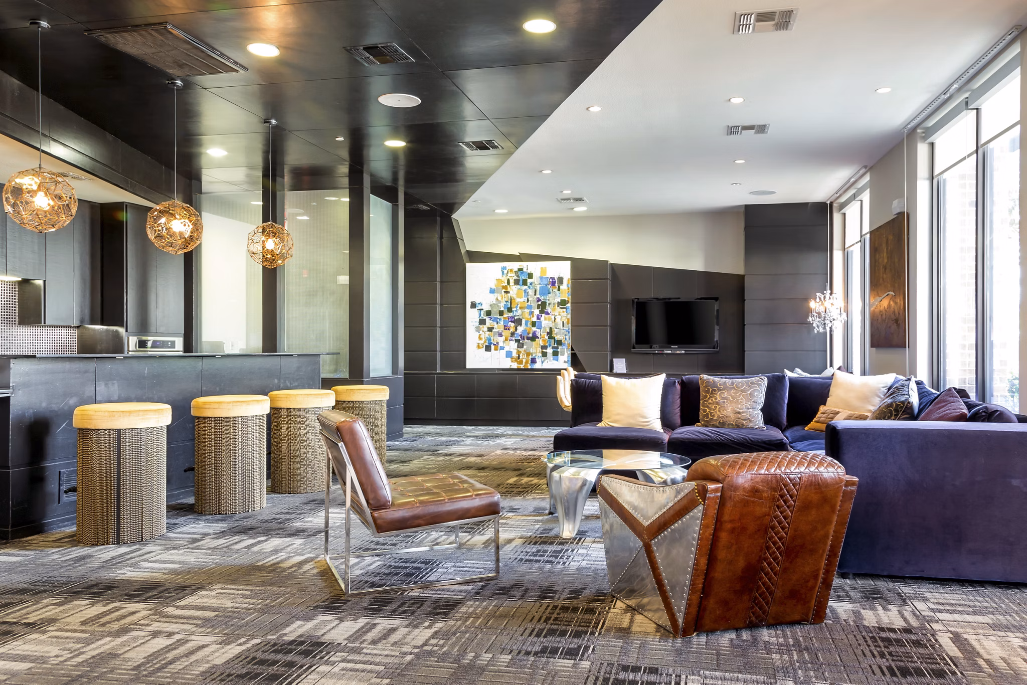 Clubhouse featuring modern decor and ample seating at The Westheimer Apartments, luxury living in Houston