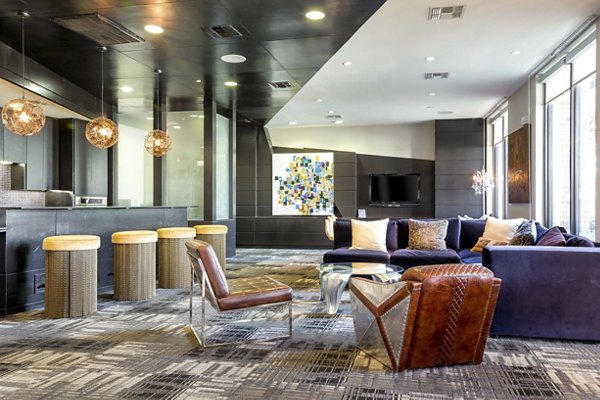 Clubhouse featuring modern decor and ample seating at The Westheimer Apartments, luxury living in Houston
