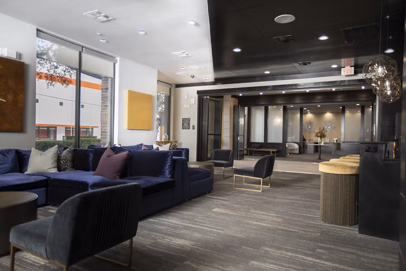 Clubhouse featuring modern design and seating at The Westheimer Apartments, luxury living in Houston