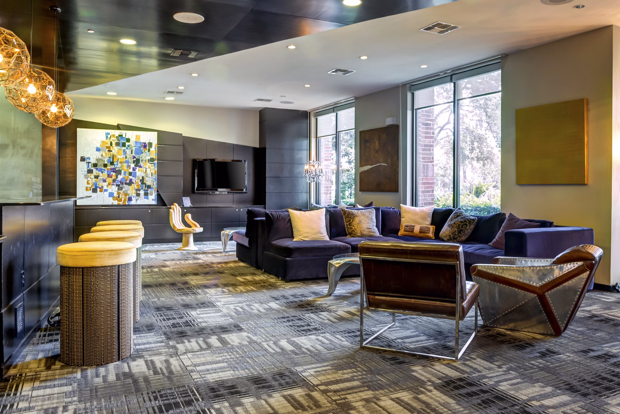 The Westheimer Apartments: Modern clubhouse featuring stylish lounge areas and vibrant decor, perfect for social gatherings and events