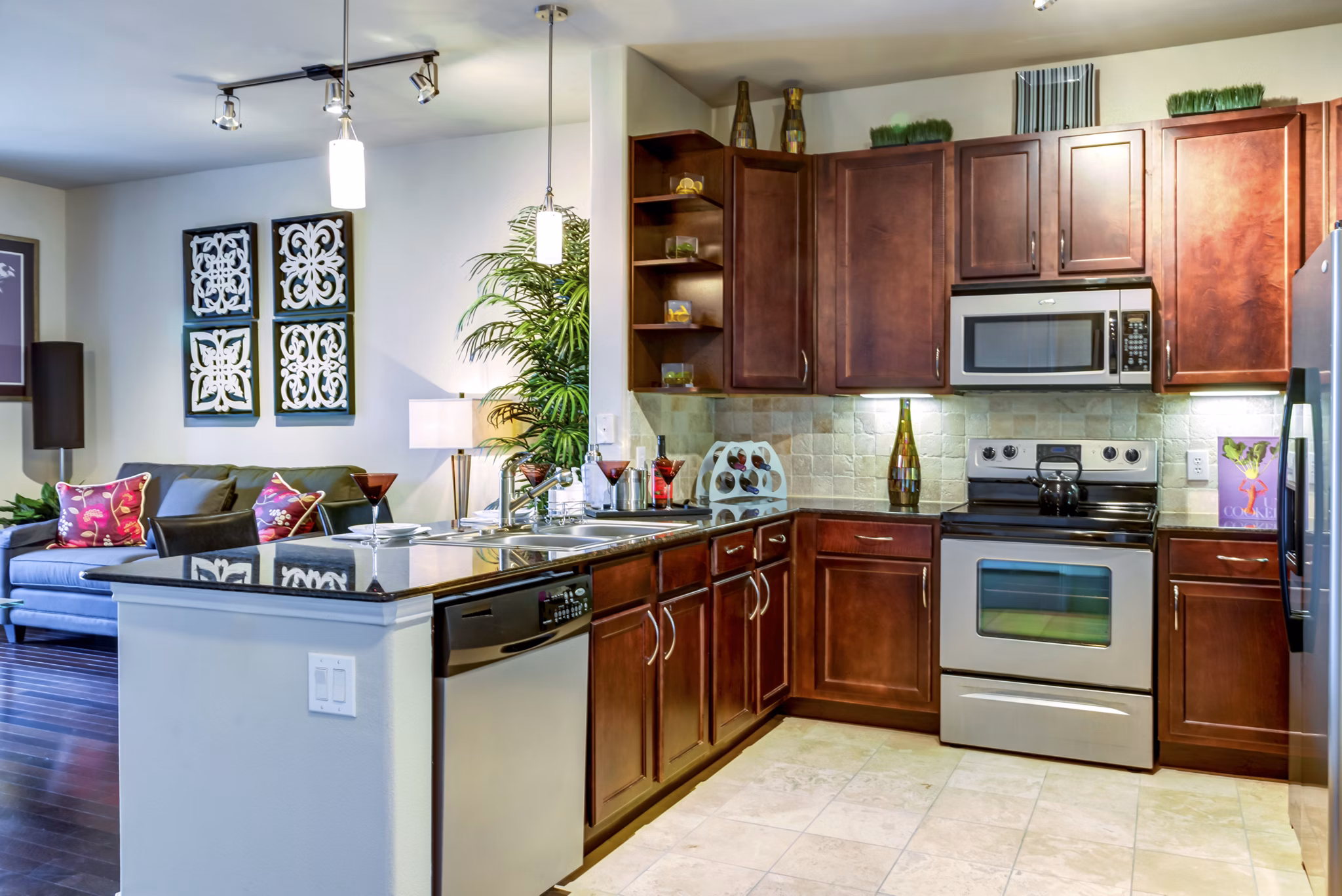 Modern kitchen with stainless steel appliances at The Westheimer Apartments