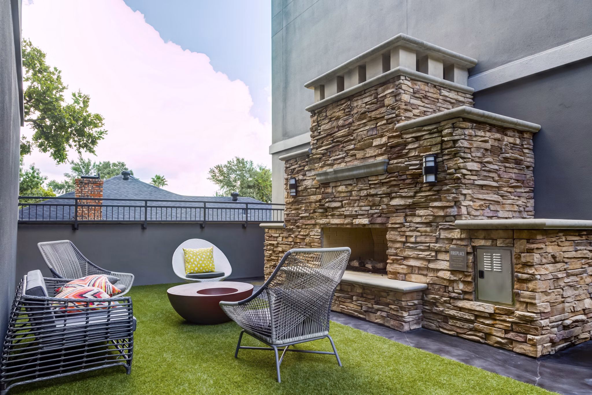 Chic outdoor patio with seating area at The Westheimer Apartments, ideal for relaxation and social gatherings