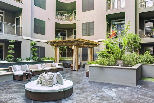 Modern outdoor patio with stylish seating at The Westheimer Apartments in Houston