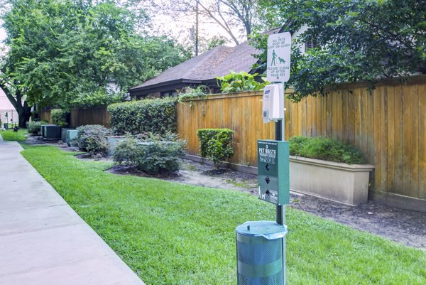 Lush dog park with play area at The Westheimer Apartments