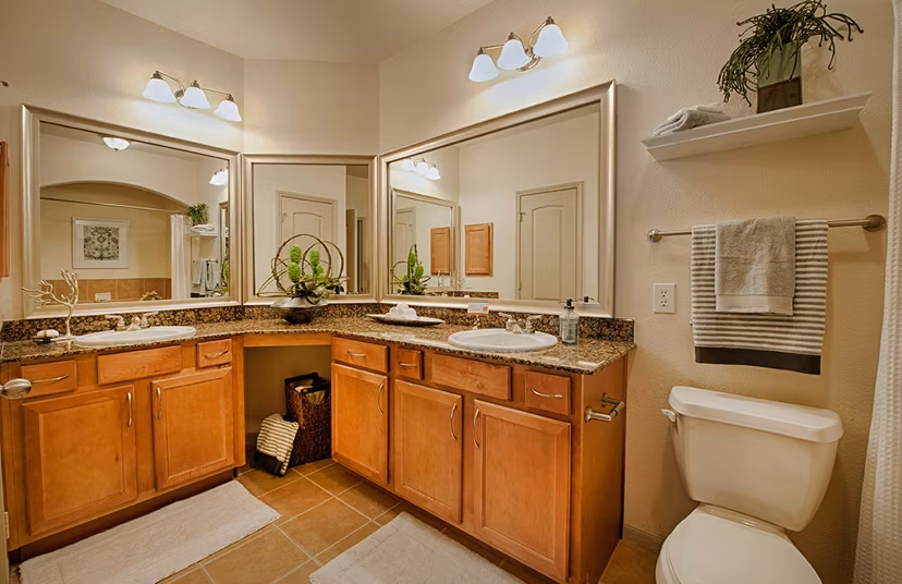 Luxurious bathroom featuring marble countertops at Monaco at Main Apartments