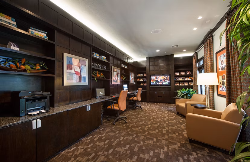 Business center with modern workstations at Monaco at Main Apartments