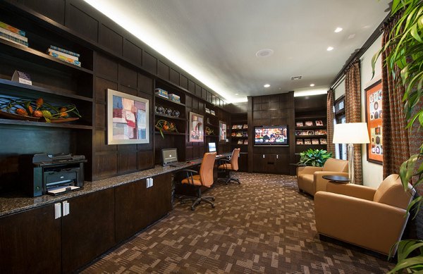 Business center with modern workstations at Monaco at Main Apartments