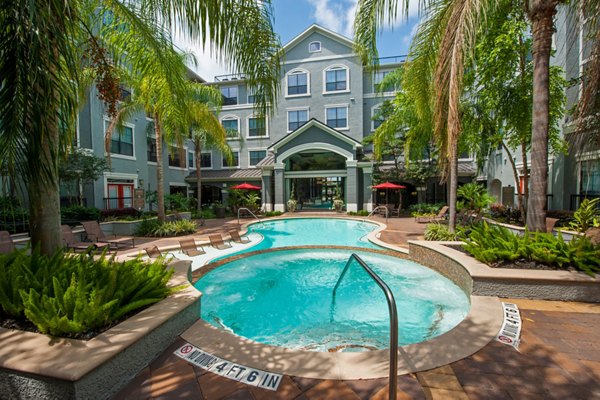 Hot tub area with inviting Jacuzzi at Monaco at Main Apartments