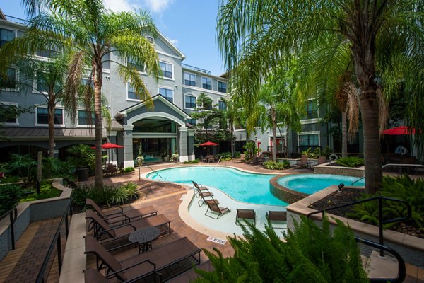 Luxury poolside lounge with modern seating at Monaco at Main Apartments, highlighting exceptional relaxation spaces