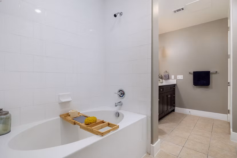 Haus 5350 Apartments: Modern bathroom with sleek fixtures and marble countertops