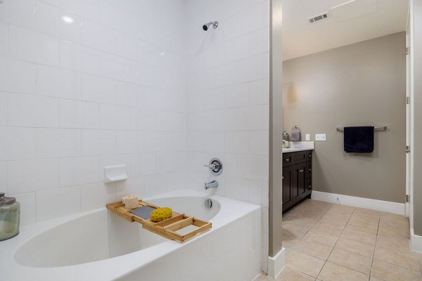 Haus 5350 Apartments: Modern bathroom with sleek fixtures and marble countertops
