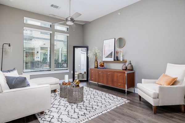Contemporary living room with modern decor and natural light at Haus 5350 Apartments Perfect for luxury living in a Greystar-managed property