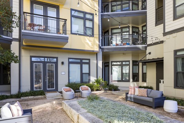 Courtyard featuring lush greenery at Haus 5350 Apartments, a luxury Greystar community in a serene setting