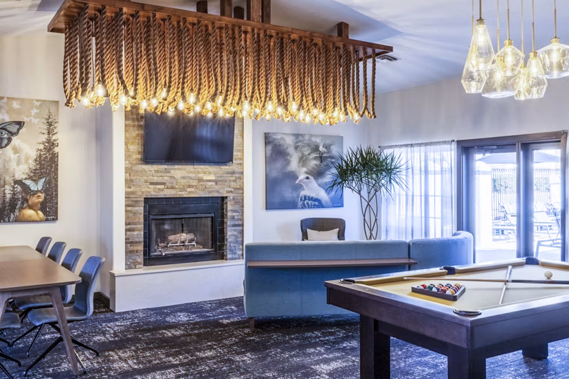 Clubhouse game room with modern design and entertainment options at OTTAVO Apartments