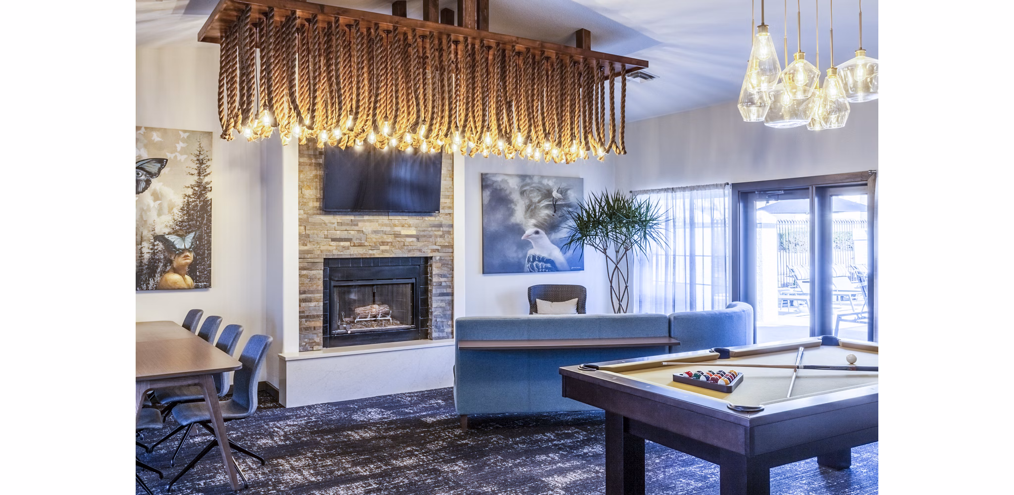 Clubhouse game room with modern design and entertainment options at OTTAVO Apartments
