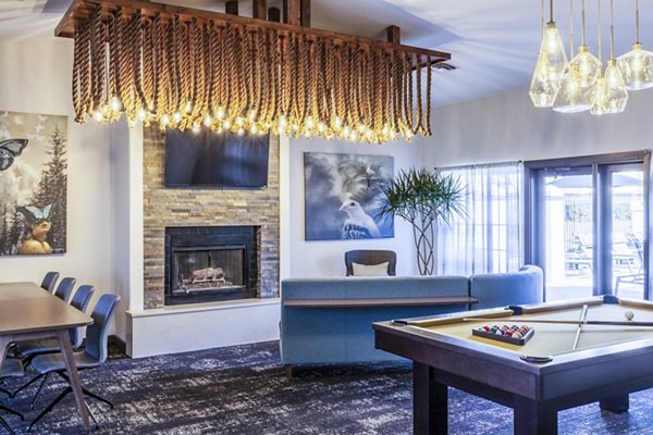 Clubhouse game room with modern design and entertainment options at OTTAVO Apartments
