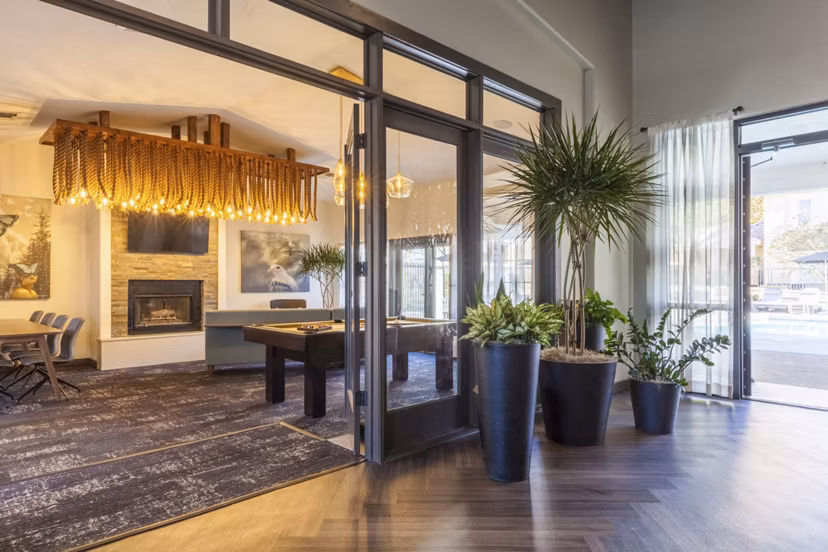 Clubhouse lounge featuring modern seating and decor at Ottavo Apartments, ideal for social gatherings and relaxation