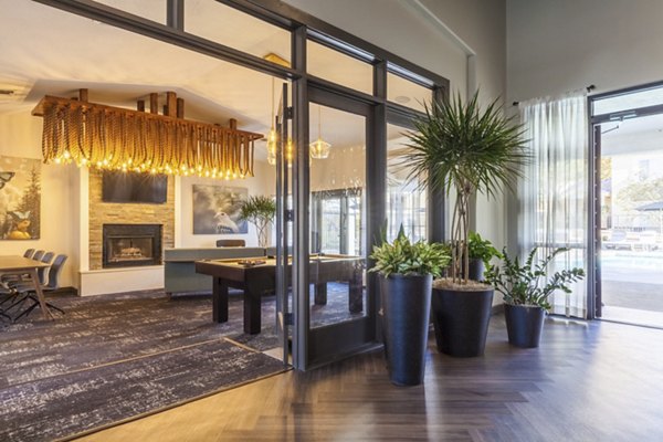 Clubhouse lounge featuring modern seating and decor at Ottavo Apartments, ideal for social gatherings and relaxation