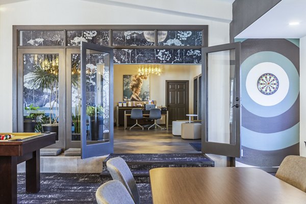 Ottavo Apartments: Modern business center with sleek workstations and high-speed internet access