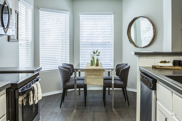 Elegant dining room with modern furnishings in OTTAVO Apartments, perfect for hosting dinners and gatherings
