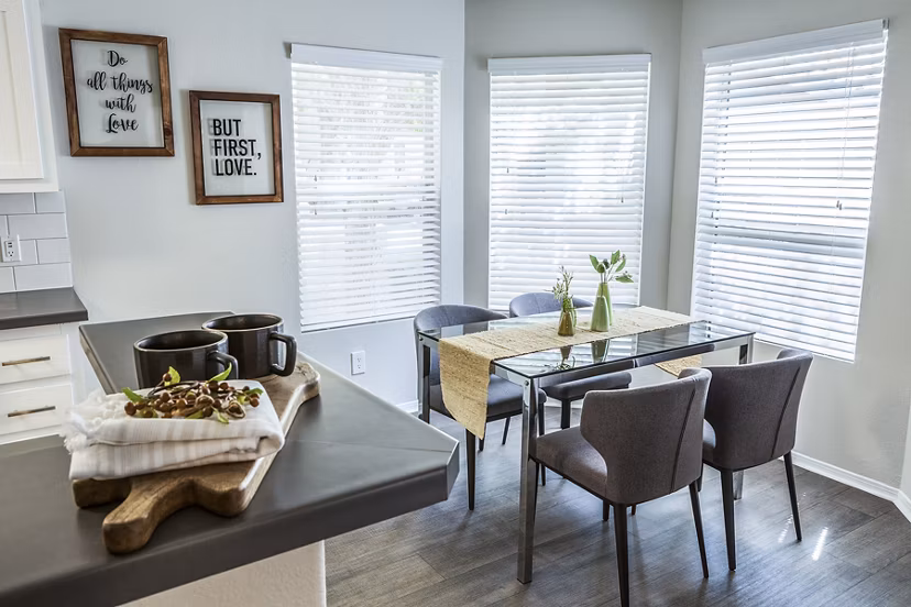 Dining room featuring modern furnishings and elegant lighting at Ottavo Apartments