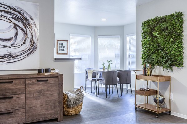 Dining room with sleek furniture and modern lighting at OTTAVO Apartments luxury community, perfect for stylish living