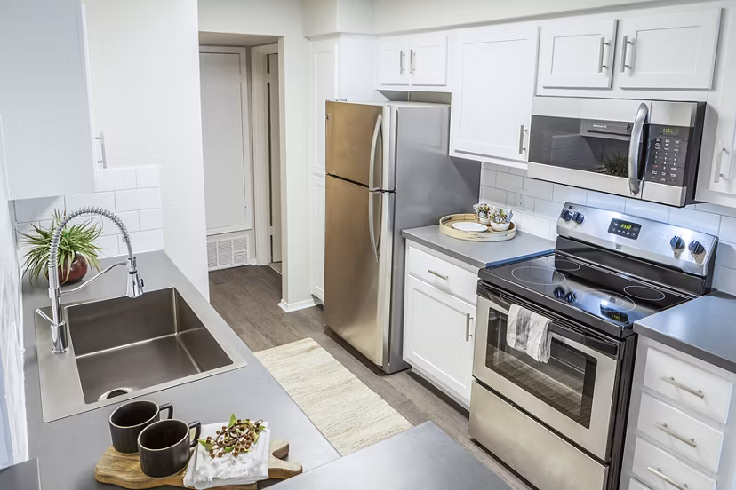 Modern kitchen with sleek cabinetry and stainless-steel appliances at Ottavo Apartments, a Greystar luxury community