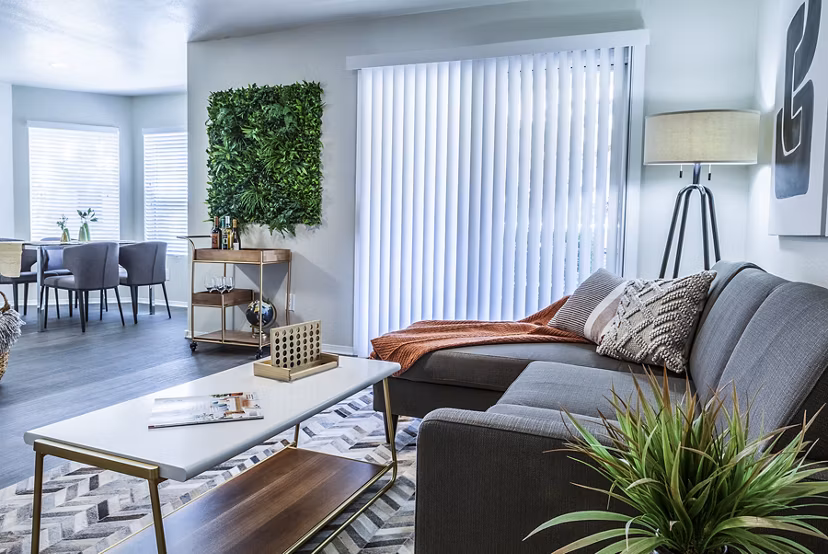 Modern living room with elegant furnishings at OTTAVO Apartments, a Greystar luxury apartment community
