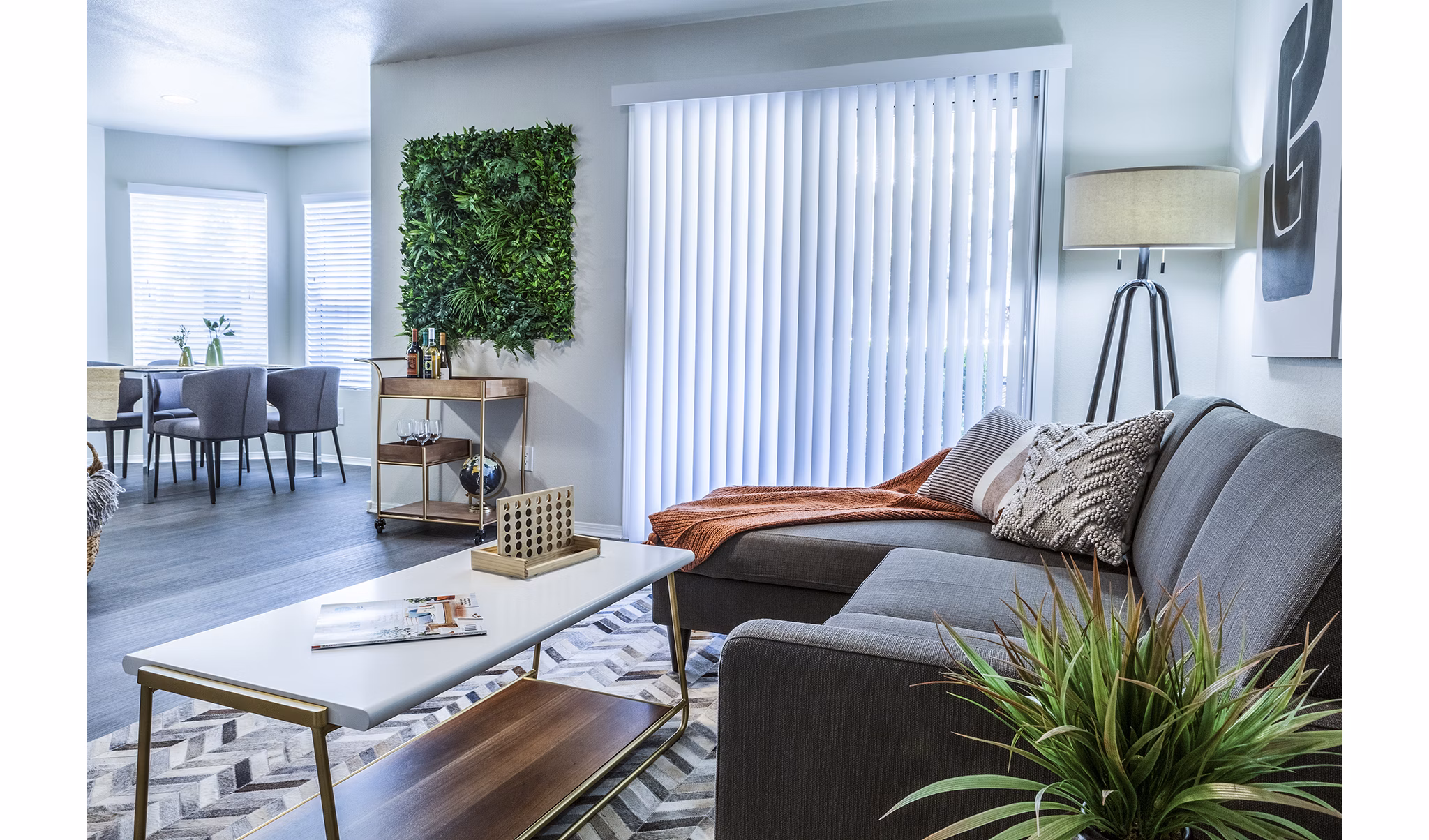 Modern living room with elegant furnishings at OTTAVO Apartments, a Greystar luxury apartment community