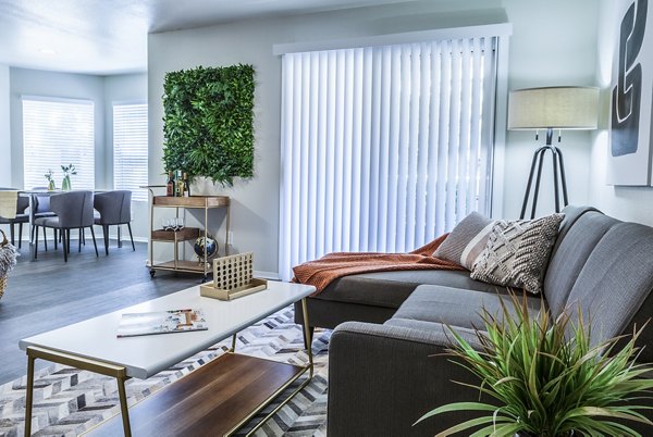 Modern living room with elegant furnishings at OTTAVO Apartments, a Greystar luxury apartment community