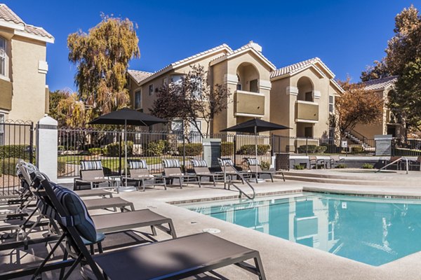 Luxury pool with lounge areas at Ottavo Apartments, a Greystar property in vibrant city setting