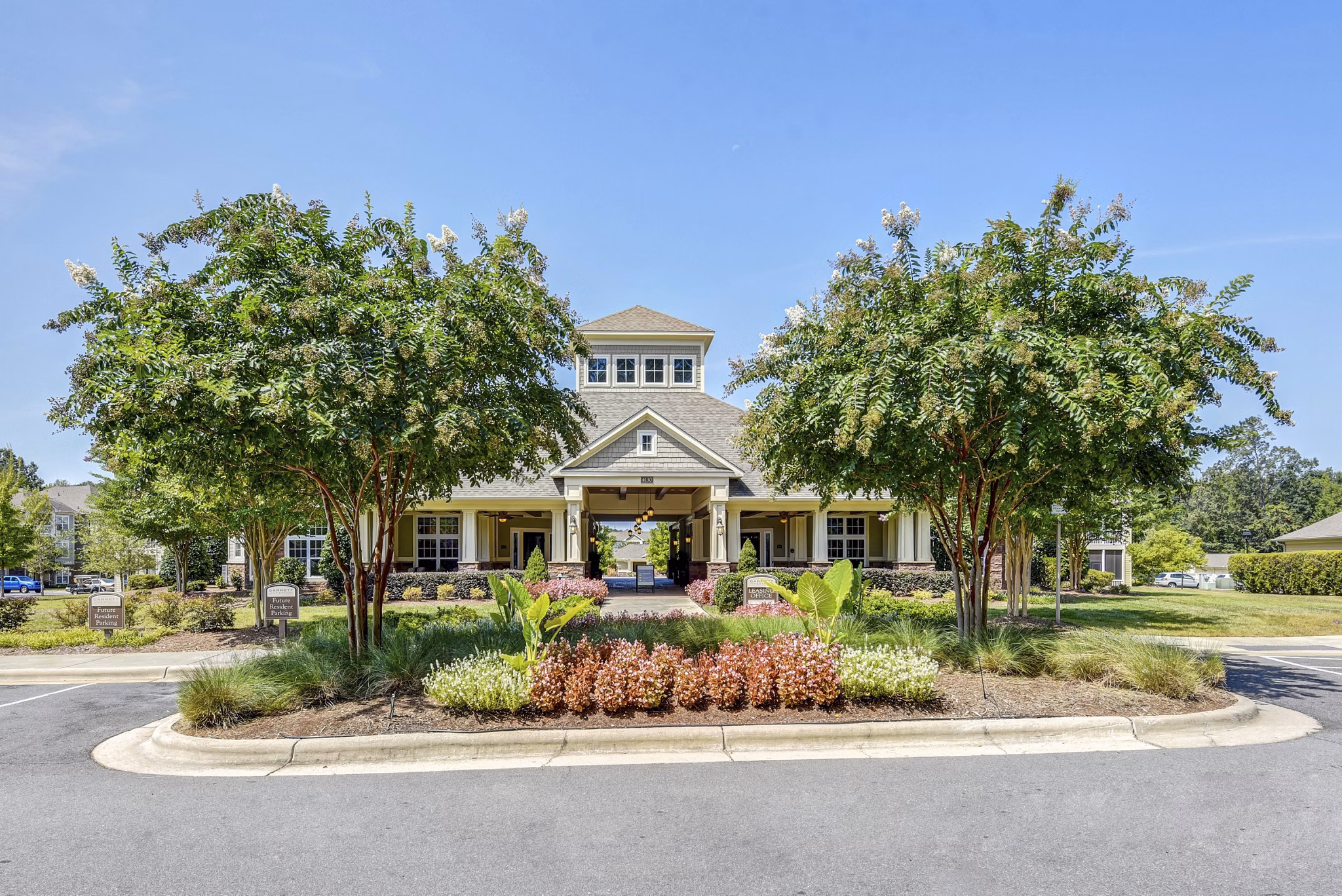 Garrett West Apartments: Elegant design featuring lush landscaping in Durham