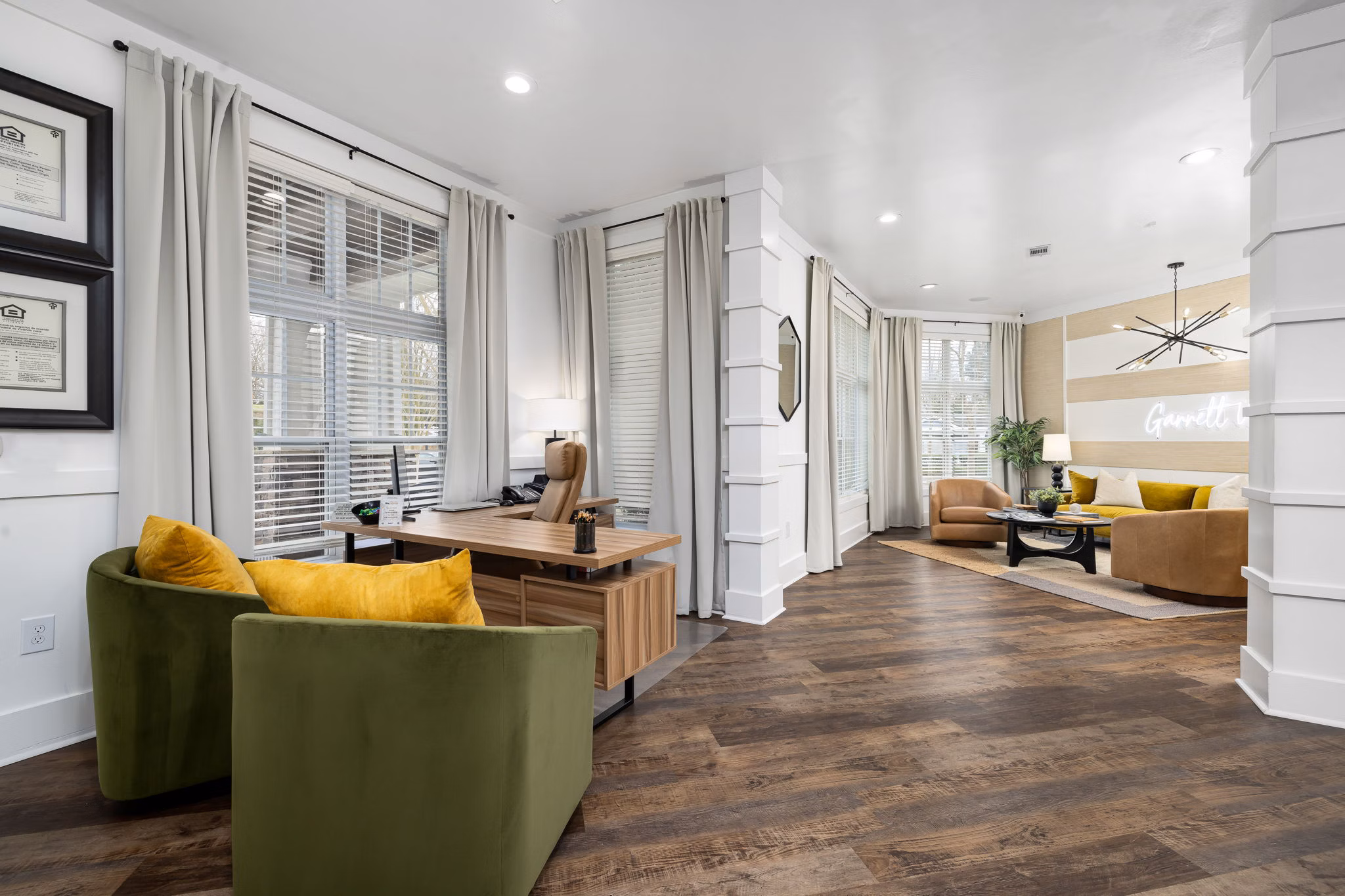 Clubhouse featuring modern design and cozy seating at Garrett West Apartments luxury living community