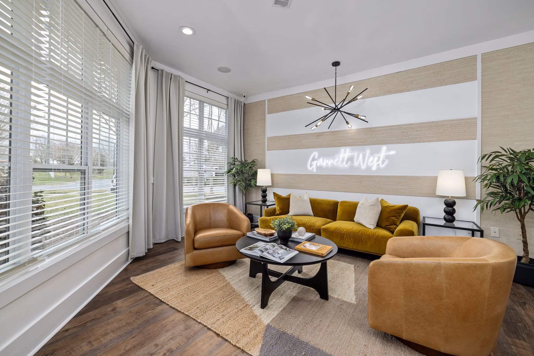 Clubhouse featuring modern design and cozy seating at Garrett West Apartments