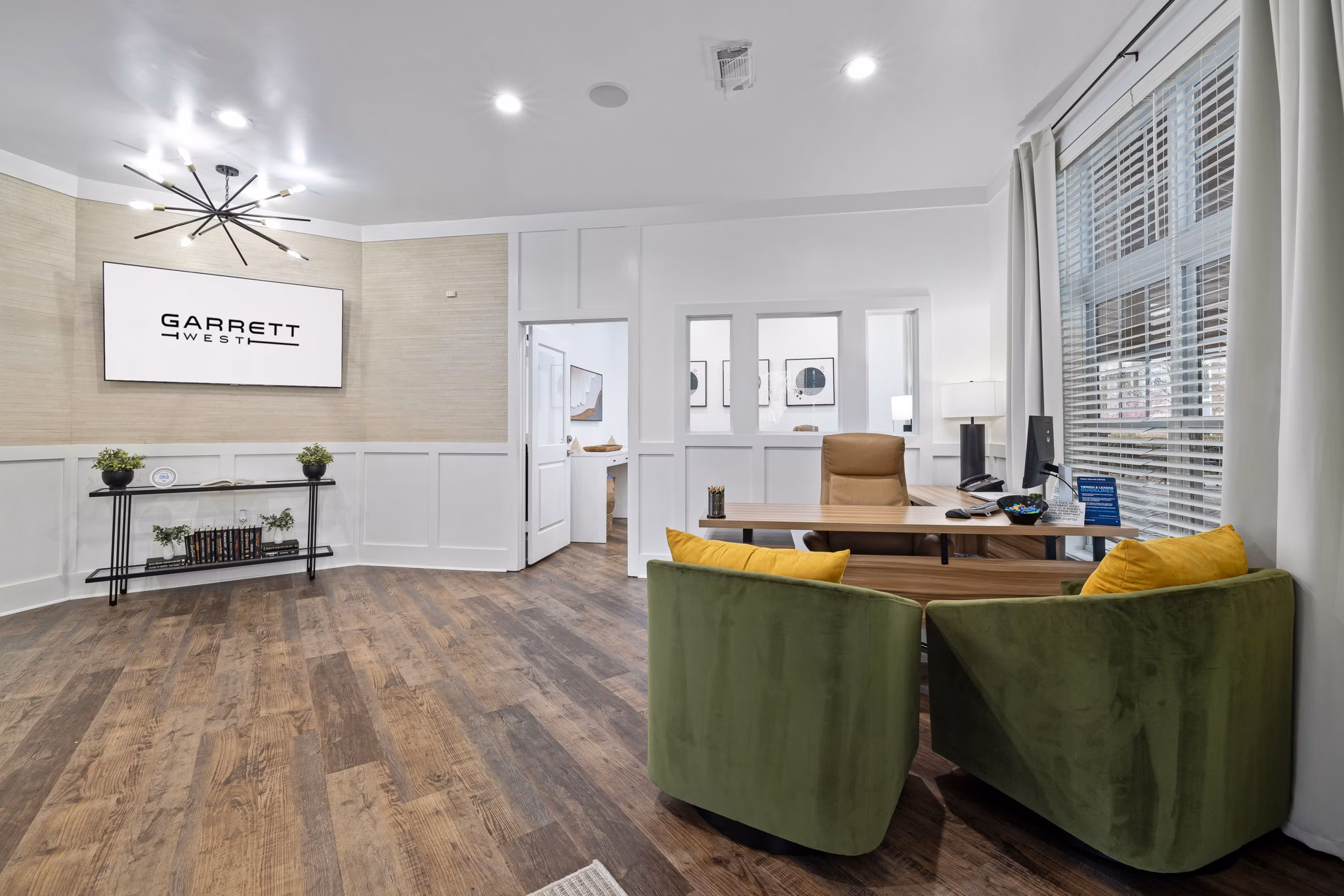 Clubhouse featuring modern design and seating areas at Garrett West Apartments