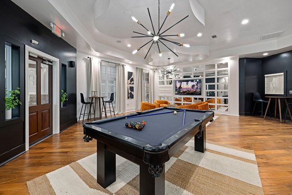 Clubhouse featuring modern design and spacious seating at Garrett West Apartments, a luxury living community