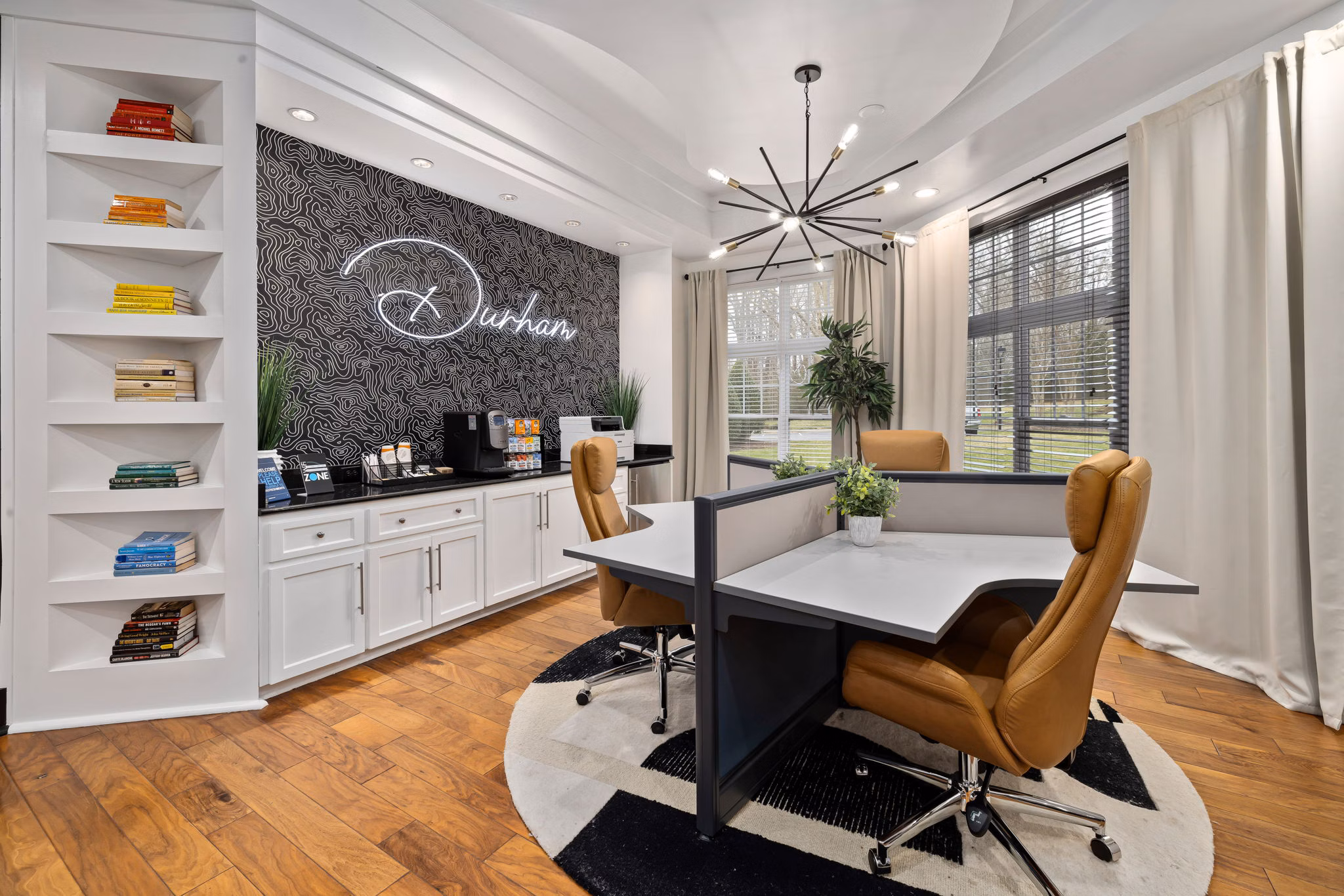 Clubhouse featuring modern design and cozy seating at Garrett West Apartments