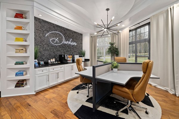 Clubhouse featuring modern design and cozy seating at Garrett West Apartments