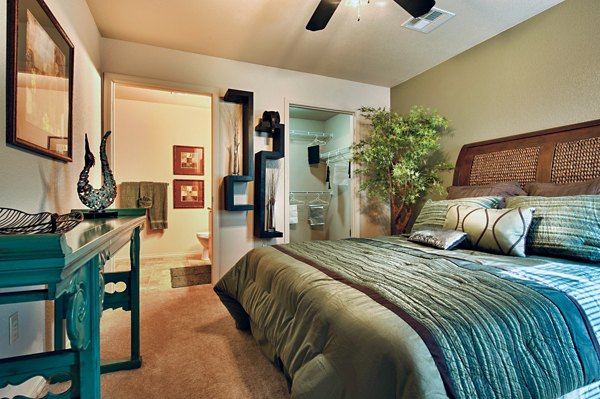 Spacious bedroom with modern furnishings at Esteban Park Apartments