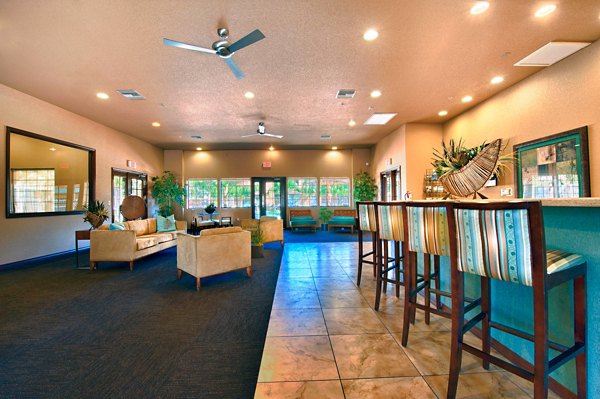 Modern clubhouse with contemporary seating and entertainment area at Esteban Park Apartments, a luxurious Greystar property