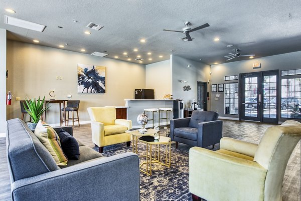 Spacious clubhouse lobby at Esteban Park Apartments featuring modern design elements and comfortable seating areas