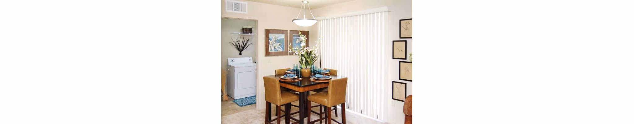 Dining room with modern decor and large windows at Esteban Park Apartments in Phoenix